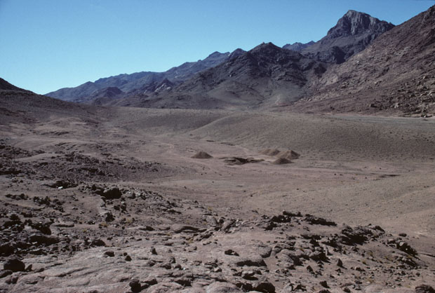 Mount Sinai, height 2382m, also called Mt Horeb in the scriptures, is seen at upper-right in this south-westward view from Wadi es Sadad 2 kilometers north of its junction with Wadi Sebaiyeh. The closer, darker mountain seen here to the left of Mt Sinai is Jebel el Muneijah, height 1825m, believed by some to be the true Mt Moses, or Jebel Musa, where the Law was given. 