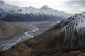 Tasman Valley south of terminal face of Tasman Glacier. Mt Cook on Main Divide in distance. Tasman River winds southward on the valley floor and receives the Hooker River from the Hooker Valley entering on the left. Burnett Mountains in foreground. 