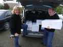 A trunk-load of Sam Neill's wines being gleefully received by the legendary entrepreneur and amazing hostess Fleur Sullivan, creator and proprietor of 