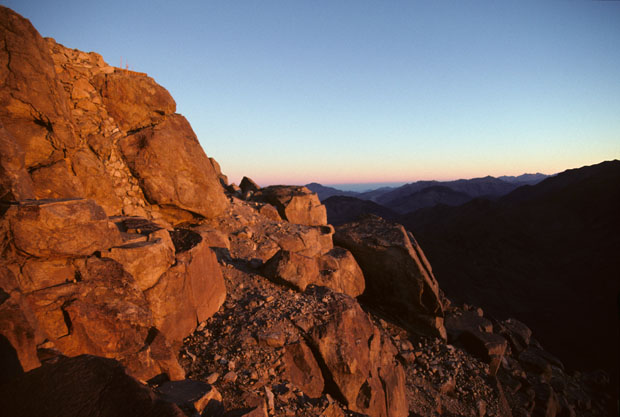 View to the south-west, at sunset, from 20 meters below the summit of Mt Sinai. Right-picture is the deeply shadowed east ridge of Mt Katerina (2635m) rising to its summit (see images 54, 55 and 56).