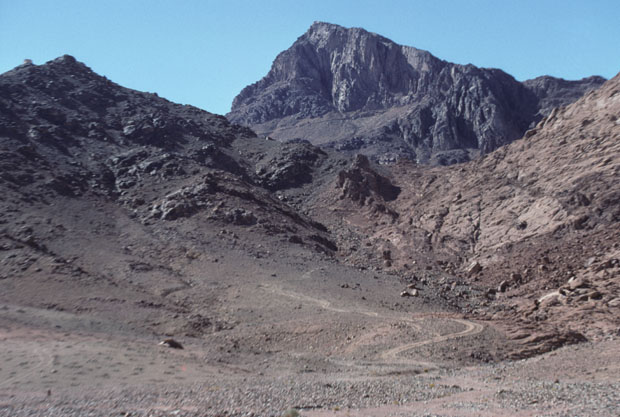 Mount Sinai, height 2382m, also called Mt Horeb in the scriptures, in a westward view from the junction of Wadi Sebaiyeh with Wadi es Sadad. The mountain seen here to the left of Mt Sinai is Jebel el Muneijah, height 1825m, believed by some to be the true Mt Moses, or Jebel Musa, where the Law was given.  