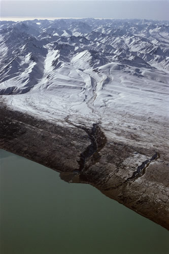 Tributary glacier river entering lake Pukaki, seen in wide-view in image 14 in which this tributary enters from left picture. 