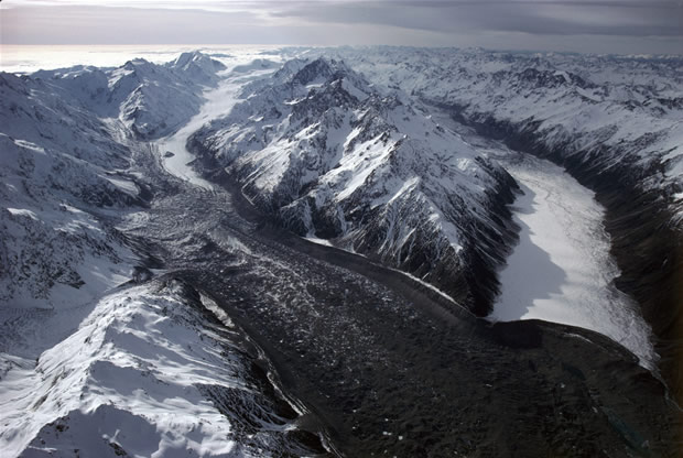 Northward view of confluence of Tasman Glacier (left) and Murchison Glacier (right) with Malte Brun Range between. The Hochstetter Glacier is seen entering from the mid-left; the Ball Glacier from the lower left.