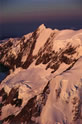 Mt Cook summit and heavily glaciered west face, in evening light in an aerial view from above the Empress Glacier. 