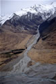 Tributary glacier valley and river entering (see image 14) the west side of the lower Tasman Valley. The tributary river is seen here being crossed by the only road access to Mount Cook Village and its famous Hermitage Hotel.